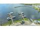 Aerial view of boat docks and marina with multiple boats docked at Historic Braden Castle community at 13 Oak St, Bradenton, FL 34208