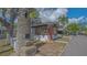 Unique property featuring a coquina shell tower and cozy cottage exterior at 13 Oak St, Bradenton, FL 34208