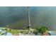 Aerial view of a long fishing pier on the water at the Historic Braden Castle community at 13 Oak St, Bradenton, FL 34208