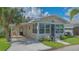 Charming stone house with a convenient carport and well-maintained landscaping, creating inviting curb appeal at 13 Oak St, Bradenton, FL 34208
