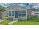 Charming home with a stone facade, covered parking, and a well-maintained front yard at 13 Oak St, Bradenton, FL 34208