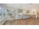 Bright kitchen with wood floors, custom cabinets, and a charming breakfast nook for relaxed dining at 13 Oak St, Bradenton, FL 34208