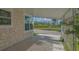 Exterior patio with view of a pond and nearby recreational vehicles at 13 Oak St, Bradenton, FL 34208