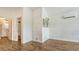 This room showcases modern style with shiplap walls, wood-look floors, and a wall-mounted air conditioning unit at 13 Oak St, Bradenton, FL 34208