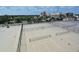 View of tennis and basketball courts, fully fenced and with city views at 13 Oak St, Bradenton, FL 34208