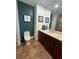 Bathroom showcasing the vanity area with marble countertops, dark wood cabinets, and a modern toilet at 130 Riviera Dunes Way # 304, Palmetto, FL 34221