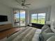 Serene bedroom with ample natural light and a private balcony at 130 Riviera Dunes Way # 304, Palmetto, FL 34221