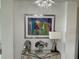 Stylish console table with unique decor and a framed abstract cityscape at 130 Riviera Dunes Way # 304, Palmetto, FL 34221