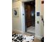 Apartment elevator showcasing wood paneling inside the elevator car and decorated hallway entrance at 130 Riviera Dunes Way # 304, Palmetto, FL 34221