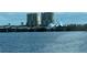 Waterfront condominiums with a large circus tent, as seen from across the waterway at 130 Riviera Dunes Way # 304, Palmetto, FL 34221
