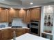 Well-equipped kitchen with stainless steel appliances and ample counter space at 130 Riviera Dunes Way # 304, Palmetto, FL 34221