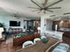 Spacious living and dining area with an open layout, modern furnishings, and a gourmet kitchen in the background at 130 Riviera Dunes Way # 304, Palmetto, FL 34221