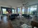 Bright and airy living room with modern décor, floor-to-ceiling windows, and views of the water and skyline at 130 Riviera Dunes Way # 304, Palmetto, FL 34221