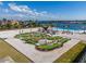 Aerial view of community's fun mini-golf course, sand traps, landscaping and waterfront views at 130 Riviera Dunes Way # 304, Palmetto, FL 34221