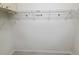Empty walk-in closet featuring wire shelving and abundant storage opportunities at 1311 Siesta Bayside Dr # 1311-A, Sarasota, FL 34242