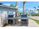 Outdoor grilling area equipped with modern grills, perfect for community gatherings and barbecues at 1311 Siesta Bayside Dr # 1311-A, Sarasota, FL 34242