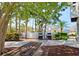 Community grilling area with picnic table and modern grills, ideal for outdoor dining and social events at 1311 Siesta Bayside Dr # 1311-A, Sarasota, FL 34242