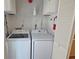 Bright laundry room features full-size, front-load washer and dryer and plenty of storage space at 1311 Siesta Bayside Dr # 1311-A, Sarasota, FL 34242