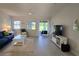 Open-concept living room showcasing water views, comfortable furniture, and stylish accents at 1311 Siesta Bayside Dr # 1311-A, Sarasota, FL 34242