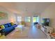 Bright living room with a view, featuring comfortable seating, decor, and plenty of light at 1311 Siesta Bayside Dr # 1311-A, Sarasota, FL 34242