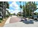 Community street lined with palm trees and well-maintained landscaping at 1311 Siesta Bayside Dr # 1311-A, Sarasota, FL 34242