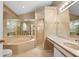 Large main bathroom featuring tub, walk-in shower and vanity with mirrors at 13511 4Th Plz E, Bradenton, FL 34212