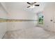 Bedroom with beach themed wallpaper, large window, and cream carpet at 13511 4Th Plz E, Bradenton, FL 34212
