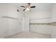 Bedroom with beach themed wallpaper and doorway to the bathroom at 13511 4Th Plz E, Bradenton, FL 34212