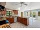 Open kitchen features granite countertops, tile floors and views of the backyard pool at 13511 4Th Plz E, Bradenton, FL 34212