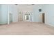 Large living room with built-in shelving, fan and light blue painted walls at 13511 4Th Plz E, Bradenton, FL 34212