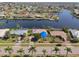 A waterfront property with mature landscaping, a pool, and quick access to the bay at 1450 Aqui Esta Dr, Punta Gorda, FL 33950