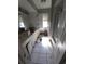 Dirty bathroom with tile flooring, white cabinets, sink, mirror and shower at 1450 Aqui Esta Dr, Punta Gorda, FL 33950