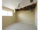 Bedroom in disrepair showing visible ceiling damage and water stains at 1450 Aqui Esta Dr, Punta Gorda, FL 33950