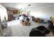 Spacious living room needing repairs, featuring tile floors, and lots of open space to make your own at 1450 Aqui Esta Dr, Punta Gorda, FL 33950
