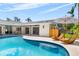 Sun-drenched pool and patio area with modern seating, perfect for outdoor lounging and entertaining at 1660 Pine Harrier Cir, Sarasota, FL 34231