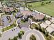 Overhead image highlights the community's amenities, including the clubhouse, pool, and surrounding landscaping at 16904 Vardon Ter # 201, Bradenton, FL 34211