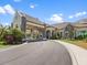 Upscale clubhouse with porte cochere, beautiful landscaping, and architectural details at 16904 Vardon Ter # 201, Bradenton, FL 34211