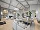 Bright clubhouse featuring stylish furniture, a fireplace, and architectural details for a sophisticated gathering space at 16904 Vardon Ter # 201, Bradenton, FL 34211