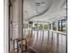Bright, spacious clubhouse room with hardwood floors, modern ceiling fans, and large windows with beautiful views at 16904 Vardon Ter # 201, Bradenton, FL 34211