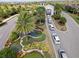Elegant gated community entrance with lush landscaping, decorative ponds, and a welcoming archway at 16904 Vardon Ter # 201, Bradenton, FL 34211