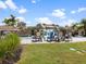 Resort-style pool with a waterfall feature and lounge chairs, offering a luxurious experience at 16904 Vardon Ter # 201, Bradenton, FL 34211