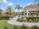 Well-maintained pool and cabana area with ample seating and manicured landscaping at 16904 Vardon Ter # 201, Bradenton, FL 34211