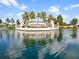 Lakewood National stone entrance sign by a tranquil pond creating an inviting arrival experience at 16904 Vardon Ter # 201, Bradenton, FL 34211