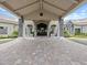 Inviting entrance with a grand portico, stone accents, and a well-paved driveway at 16904 Vardon Ter # 201, Bradenton, FL 34211