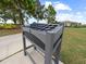 Gray golf club cleaning station on the course with green grass and trees in the background at 16904 Vardon Ter # 201, Bradenton, FL 34211