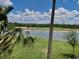 View from screened-in lanai, overlooking a serene golf course and water feature at 16904 Vardon Ter # 201, Bradenton, FL 34211