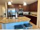 Kitchen with granite countertops, modern stainless steel appliances, and tile flooring at 16904 Vardon Ter # 201, Bradenton, FL 34211