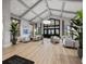 Grand lobby area with high ceilings, modern furnishings, stylish decor and a beautiful wooden-look flooring at 16904 Vardon Ter # 201, Bradenton, FL 34211