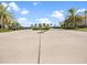 Wide parking lot with neatly parked golf carts and well-maintained landscaping at 16904 Vardon Ter # 201, Bradenton, FL 34211