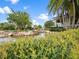 Picturesque water feature with rocky edges and lush greenery adding to the community's charm at 16904 Vardon Ter # 201, Bradenton, FL 34211